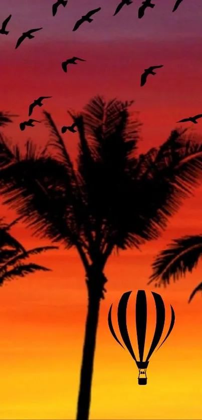 Tropical sunset with palm trees and hot air balloon.