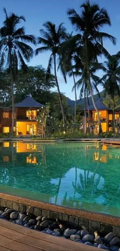 Tropical resort with palm trees at sunset by a pool.