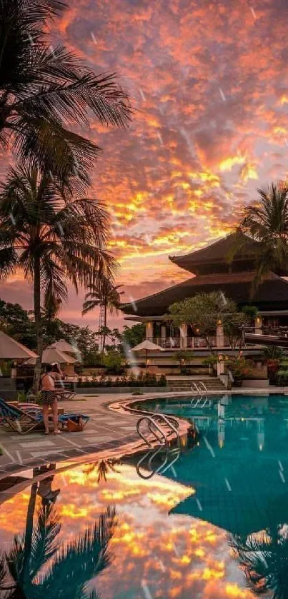 Tropical sunset over poolside paradise with vibrant sky reflections.