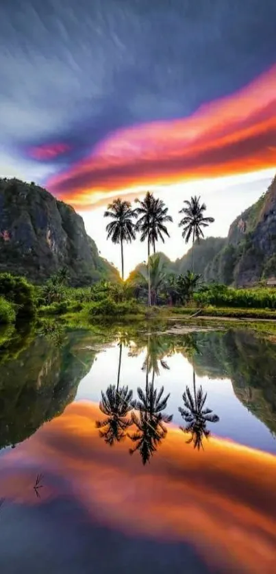 Tropical sunset with vibrant sky reflecting on calm water between lush green mountains.