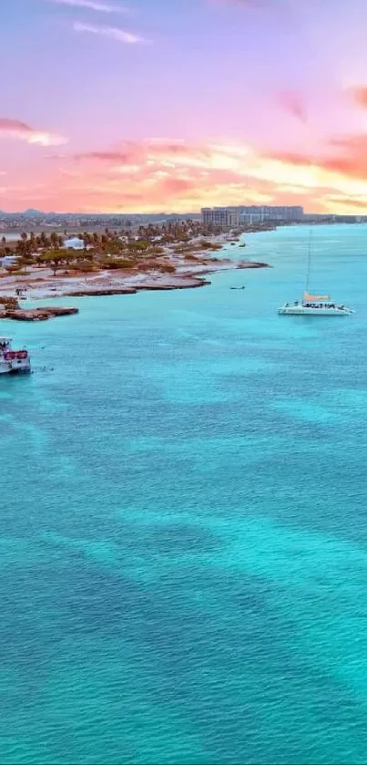 Tropical beach sunset with turquoise sea and boats.