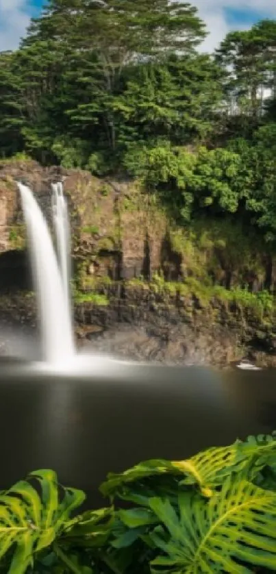 Stunning tropical waterfall with lush greenery and bright sky.