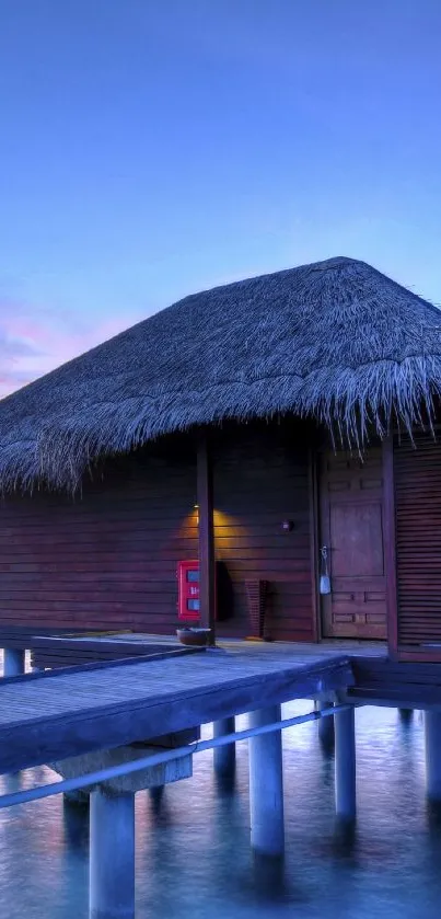 Tropical overwater bungalow at sunset reflecting serene waters.