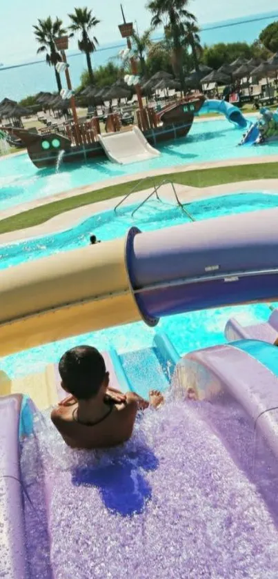 Vacay-inspired pastel water slide scene with sunny beach backdrop.