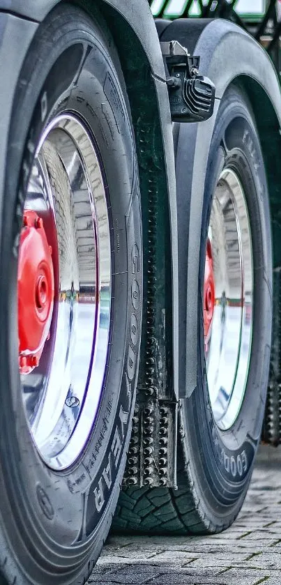 Detailed mobile wallpaper of truck wheels with gray and black tones.