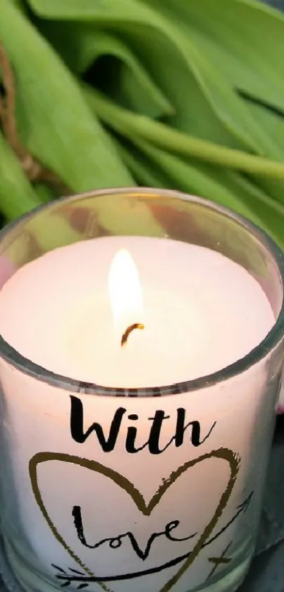 Romantic setup with tulips and a candle on a quilted surface.