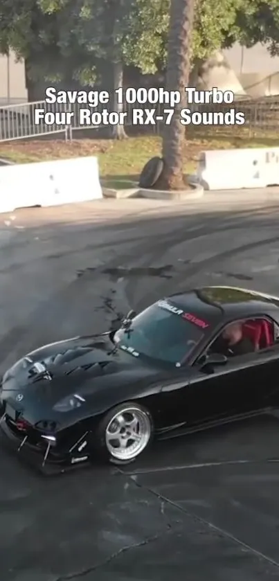 Turbocharged black RX-7 drifting on a race track with smoke clouds.