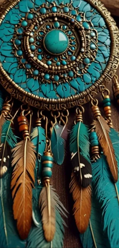Turquoise dreamcatcher with feathers on wooden background.