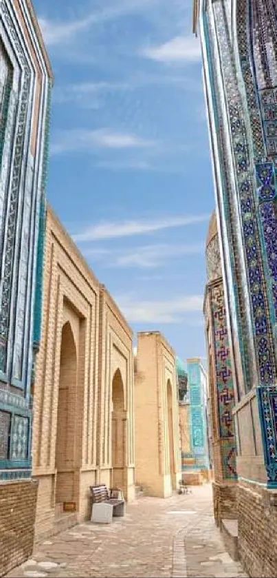 Turquoise mosaic alleyway with intricate designs and blue sky.