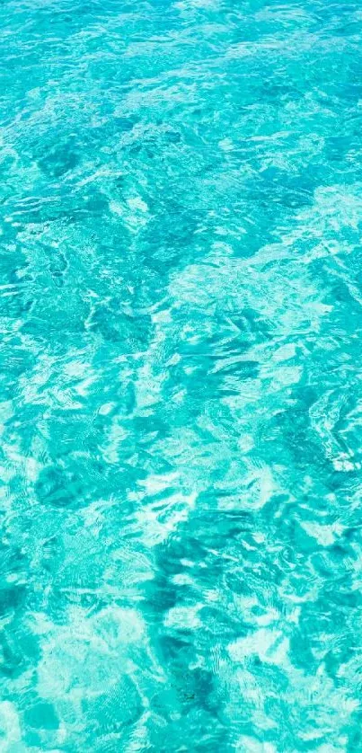 Turquoise ocean water wallpaper for mobile background.