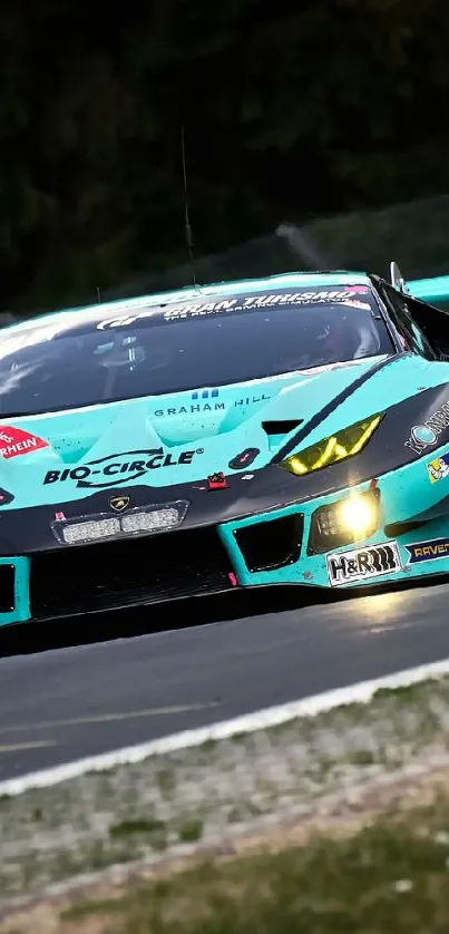 Turquoise race car speeding on a track under a cloudy sky.