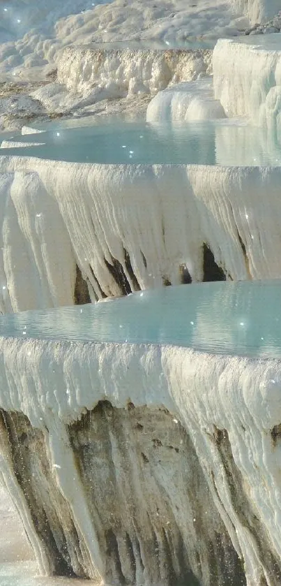 Serene turquoise thermal terraces cascading with water.