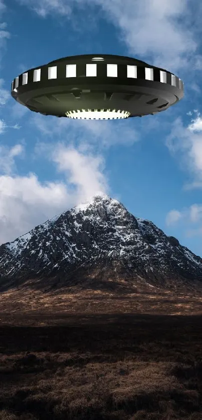 UFO hovers over a snowy mountain under a bright blue sky.