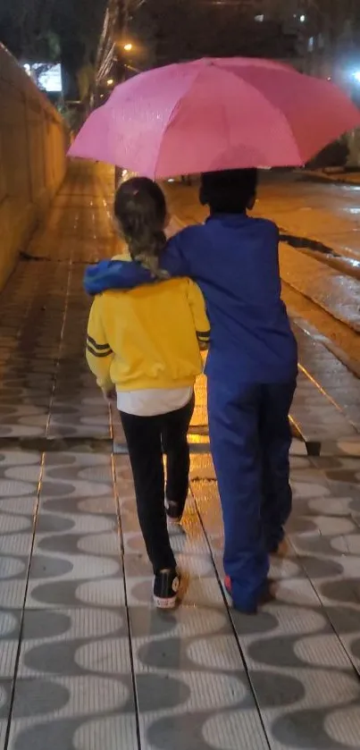 Two friends walk under a pink umbrella on a rainy night.