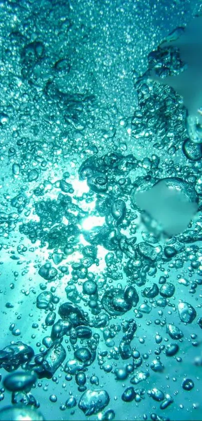 Underwater bubbles reflecting light in turquoise water.