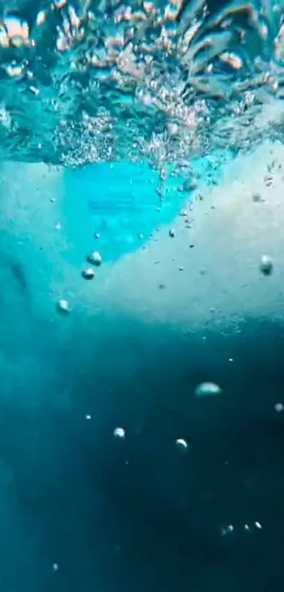 Underwater view with bubbles in vibrant blue water.