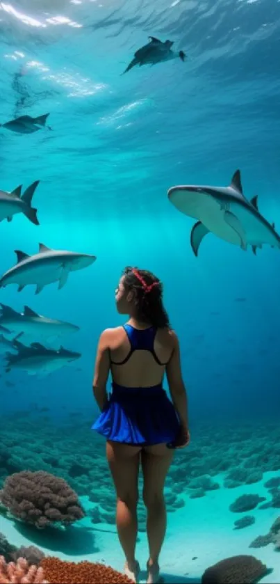 Woman swimming with sharks underneath clear turquoise waters and coral reefs.