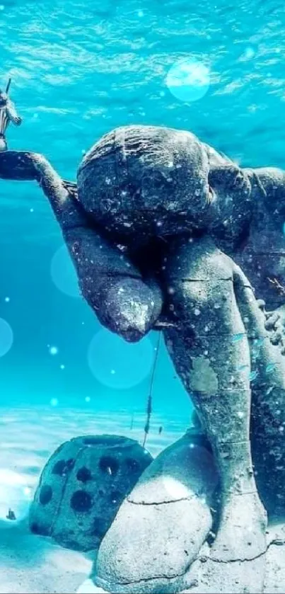 Serene underwater statue in blue ocean.