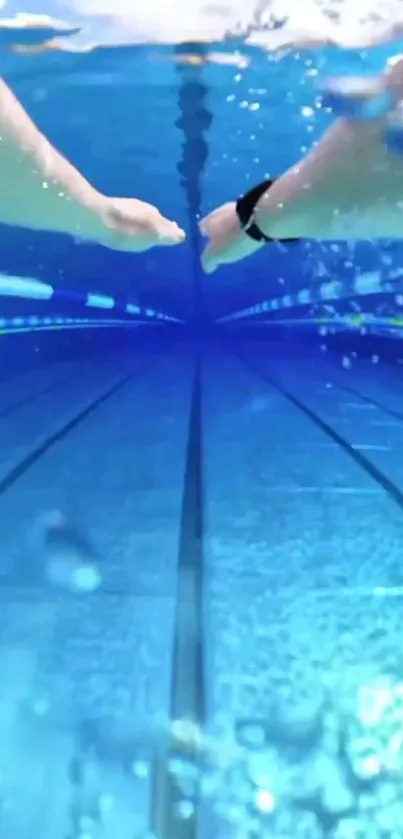 Underwater view in a swimming pool with outstretched hands.