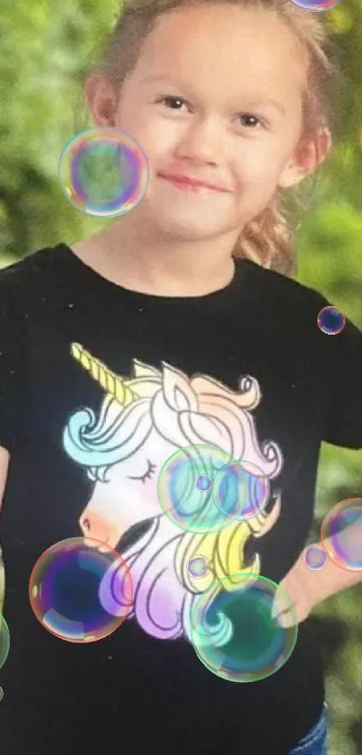 Girl in unicorn shirt in vibrant green forest wallpaper.