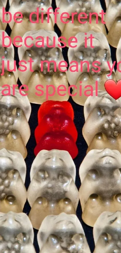 Red gummy bear among translucent ones with special message.