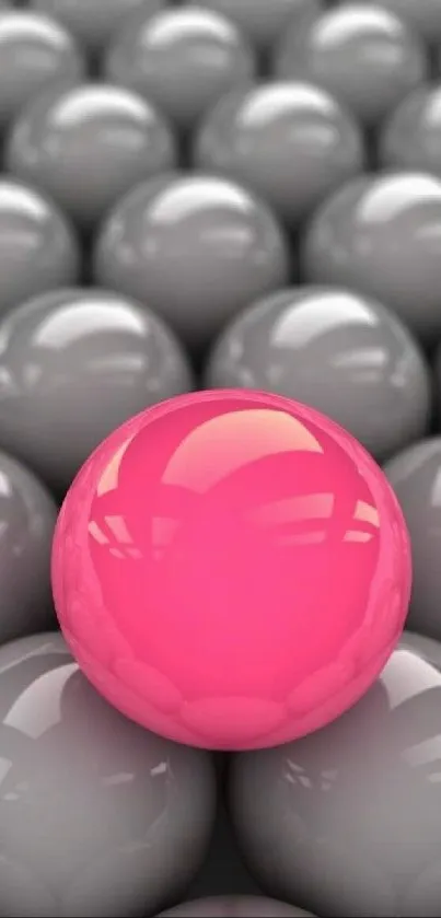 Vibrant pink sphere among grey spheres mobile wallpaper.