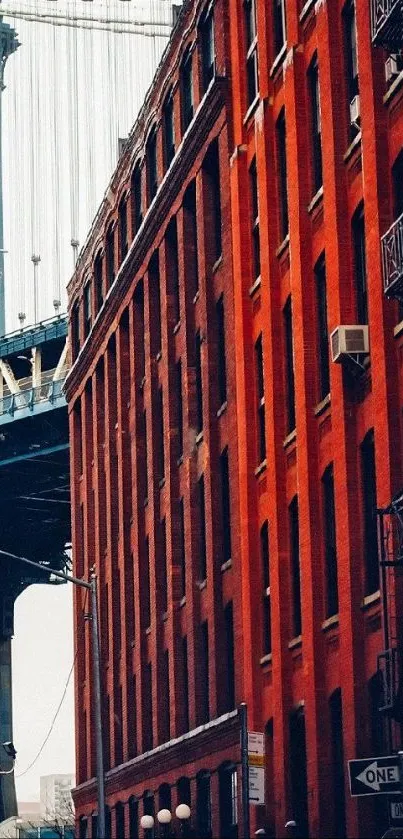 Red brick building with bridge in background