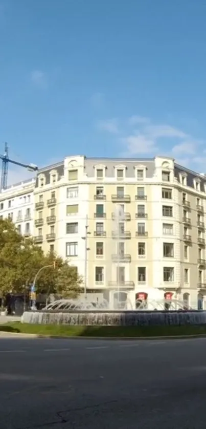 Urban landscape with a stylish building and blue sky.