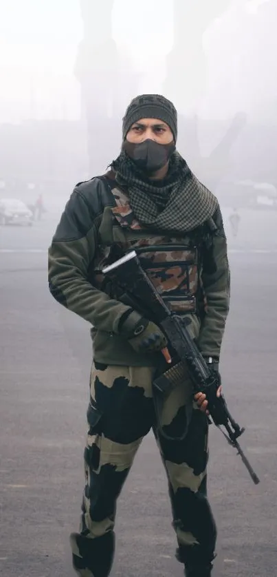 Urban soldier in camouflage holding a rifle, fog background.