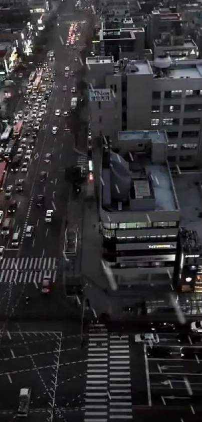 Aerial view of a bustling city at night with illuminated streets.