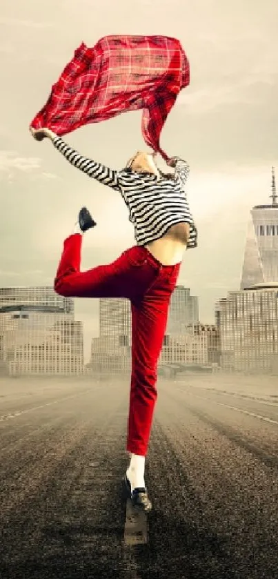 Dancer in red pants leaping in front of a city skyline