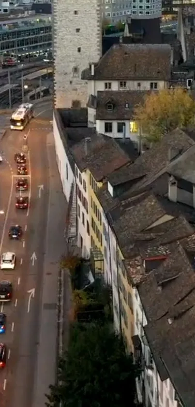 Aerial view of city street with historic buildings at dusk.