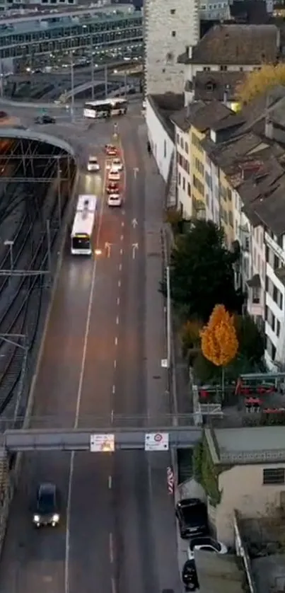 Urban evening cityscape with roads and buildings.