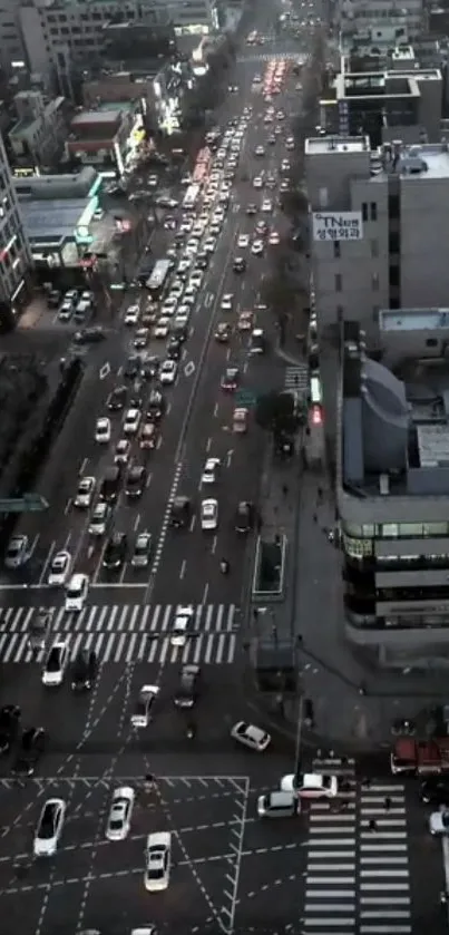 A bustling city street with evening traffic and lights.