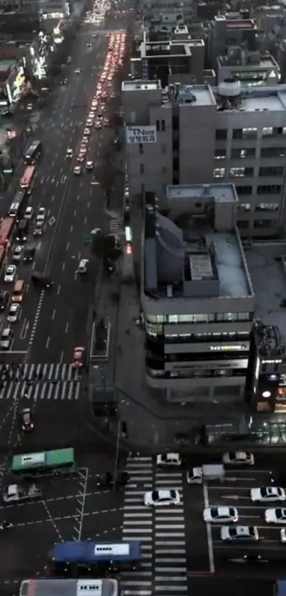 Aerial view of city traffic during evening hours with urban buildings.