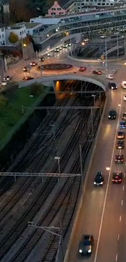 A mobile wallpaper showing urban traffic and railway at dusk.