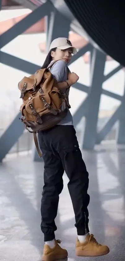 Stylish urban explorer with backpack in a modern setting.