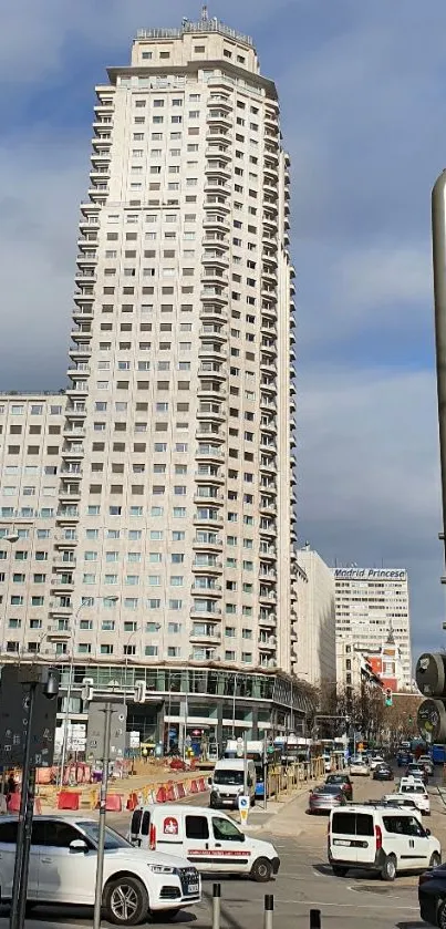 Urban high-rise building with a bustling city street.