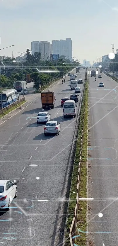 Aerial view of urban highway with moving cars and green surroundings.