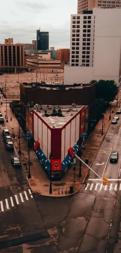 Aerial view of city intersection with buildings and streets.