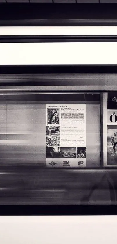 Monochrome subway in motion with blurred city posters on walls.