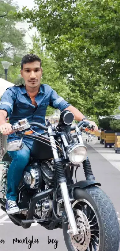 Man riding motorcycle on city pathway with trees in background.