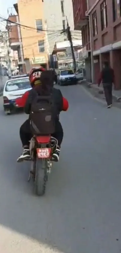 Person on motorcycle exploring an urban street, showcasing vibrant city life.