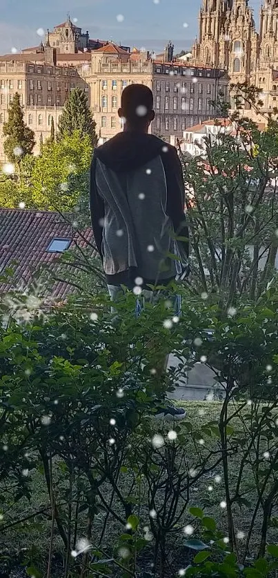 Silhouette overlooking cityscape with lush greenery and snowflakes.