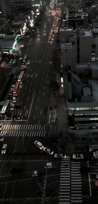 Aerial view of vibrant urban night city with bustling traffic.