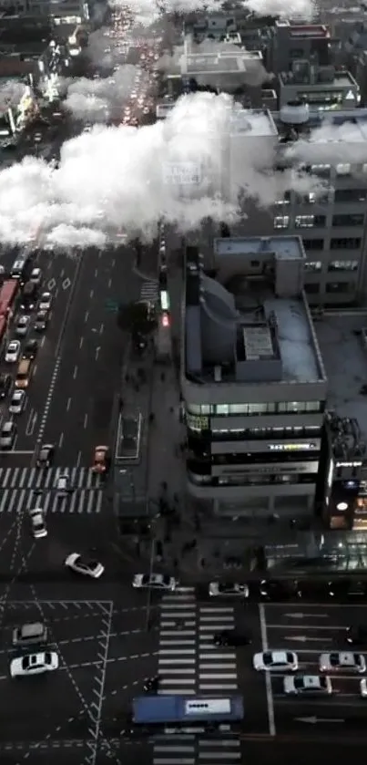 Aerial view of city streets with clouds and traffic at night.