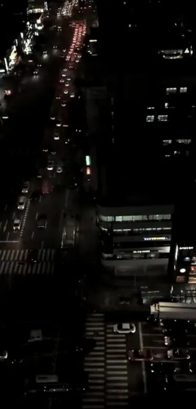 Dark cityscape view with illuminated streets at night.