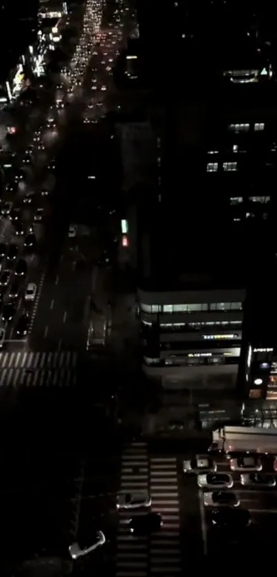 A stunning aerial view of a city street filled with cars at night.