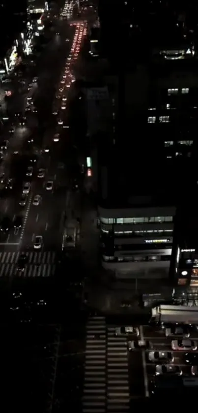 Night view of urban traffic and city streets illuminated by lights.