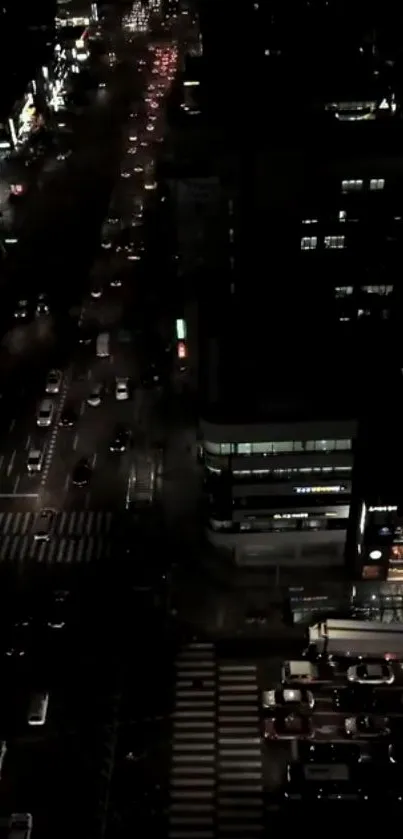 City night traffic view with illuminated urban street and buildings.